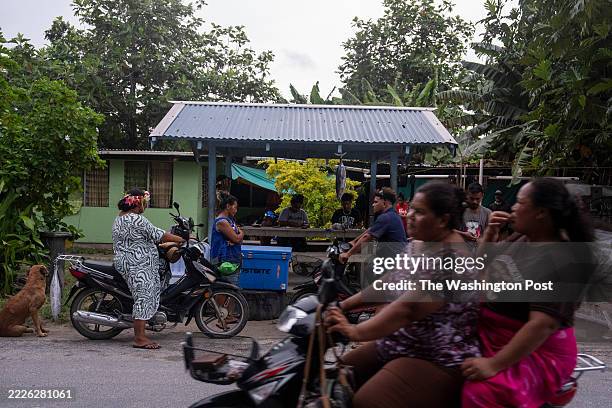 The __ family sells and cooks tuna at their home in Funafuti, Tuvalu on April 4, 2025. Tuvalu, a nation made of nine tiny islands in the South...