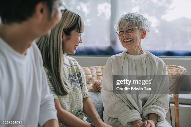 happy japanese family enjoying quality time at home - daughter in law stock pictures, royalty-free photos & images