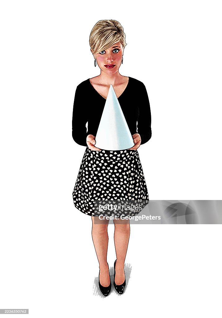 Young woman holding dunce cap