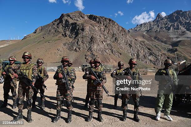 Indian army soldiers with the latest weapons, such as launchers, machine guns, and modern assault rifles, perform tactical drills on the occasion of...