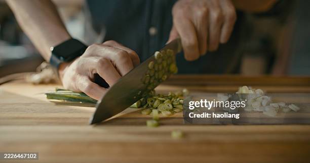 chopping spring onion - chef chopping vegetables stock pictures, royalty-free photos & images