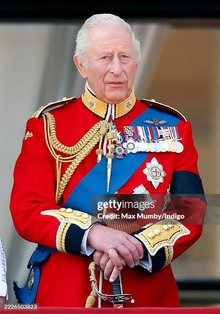 King Charles III watches an RAF flypast from the balcony of Buckingham Palace after attending Trooping The Colour 2025 on June 14, 2025 in London,...