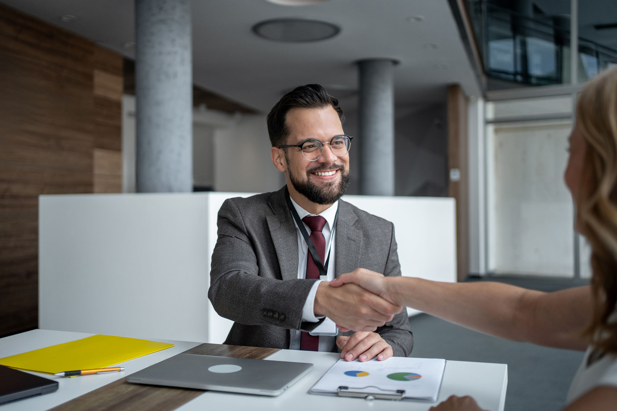 Businessman shaking hands with client after successful meeting Businessman shaking hands with client after successful meeting