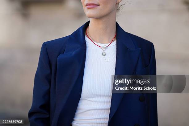 Marlies Pia Pfeifhofer is seen wearing a navy blue oversized double-breasted Biarritz blazer from Article Blazers; a white ribbed fitted Dena tank...