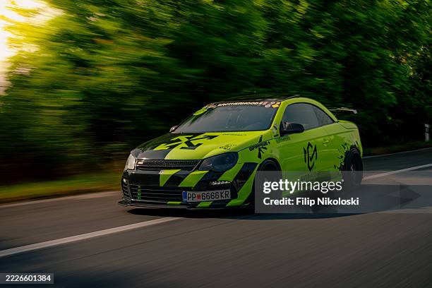 a modern vw eos driving on highway in macedonia - editorial use only - modified car stock pictures, royalty-free photos & images