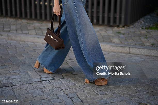 Marlies Pia Pfeifhofer is seen wearing light blue washed ultra wide leg Paloma jeans in structured denim with high waist and long flared silhouette...