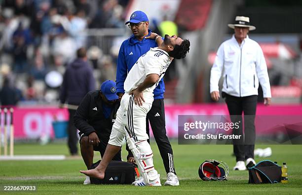 India batsman Rishabh Pant reacts in pain after taking a blow to the foot during day one of the Fourth Test Match between England and India at...
