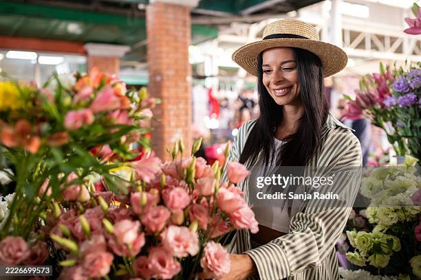 enjoying a colorful flower market - bouquet stock pictures, royalty-free photos & images