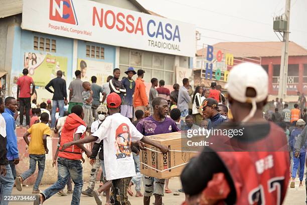 Group of shops are targeted as looting erupted in the Kalemba 2 district of Luanda on July 28, 2025 during a general strike in the taxi sector...