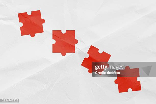 red coloured four jigsaw puzzle pieces scattered randomly in a row over blank white crumpled paper background for finding solution to complex problems related business presentations, slide shows - disassembled stock illustrations