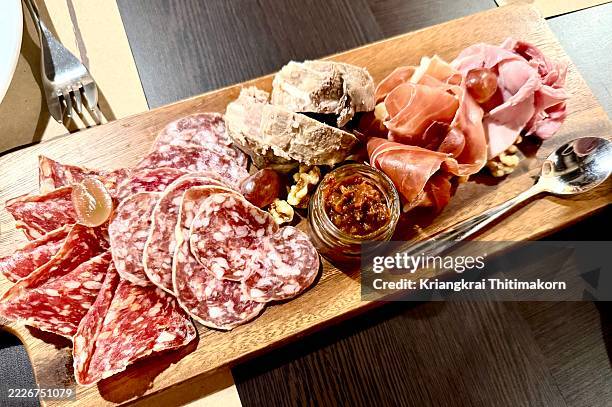 cold cuts, also known as lunch meats, deli meats, or sliced meats, are precooked or cured meats that are typically sliced and served cold, often in sandwiches or as part of a platter. - antipasto stock pictures, royalty-free photos & images