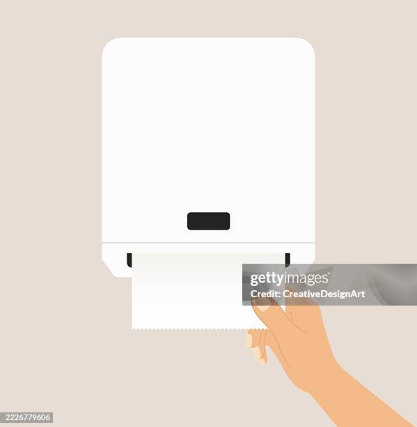 close-up of hand taking paper towel from wall-mounted dispenser - kitchen paper stock illustrations