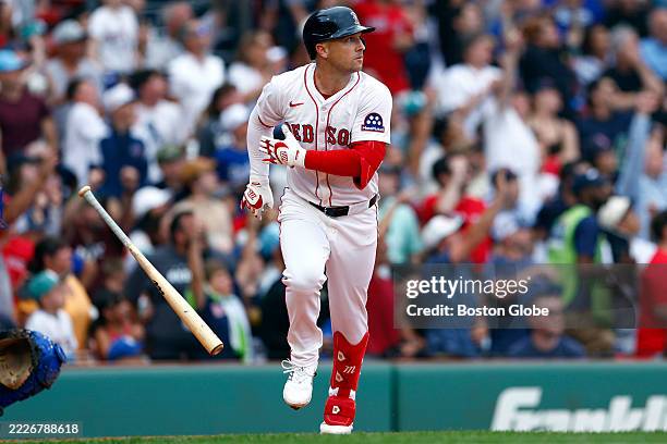 Boston Red Sox third baseman Alex Bregman tosses his bat after hitting a home run against the Los Angeles Dodgers in the fifth inning at Fenway Park...