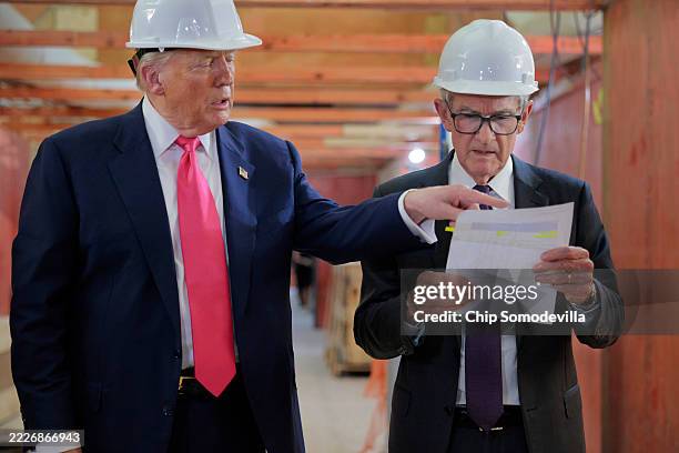 President Donald Trump presents Federal Reserve Chair Jerome Powell with what he Trump called a list of cost overruns for the Federal Reserve’s $2.5...