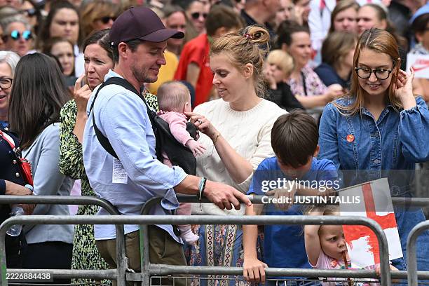 Britain's Princess Beatrice of York her husband Edoardo Mozzi and children Sienna, Athena and Christopher joins fans lining the Mall waiting to greet...