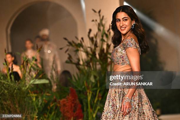 Bollywood actress Sara Ali Khan presents a creation by designer Aisha Rao during India Couture Week in New Delhi on July 29, 2025. / RESTRICTED TO...
