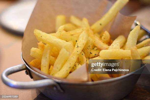 french fries served in a tin plate - french fries stock pictures, royalty-free photos & images
