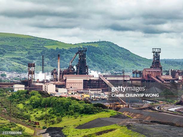 port talbot steelworks dominating the landscape in south wales - south wales stock pictures, royalty-free photos & images