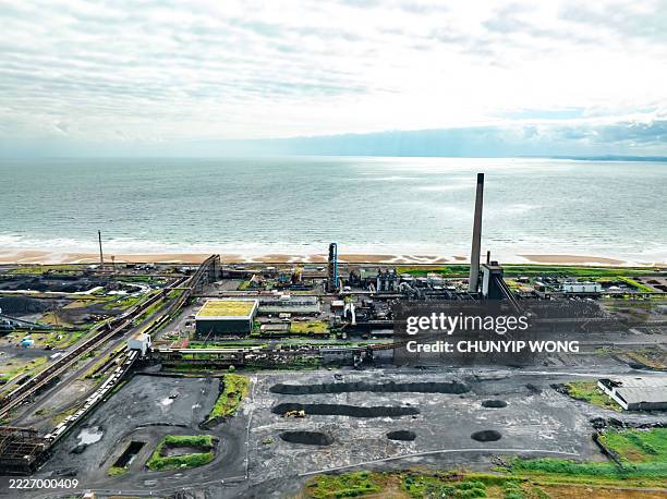 blast furnace and steelworks at port talbot, south wales, overlooking the bristol channel - south wales stock pictures, royalty-free photos & images