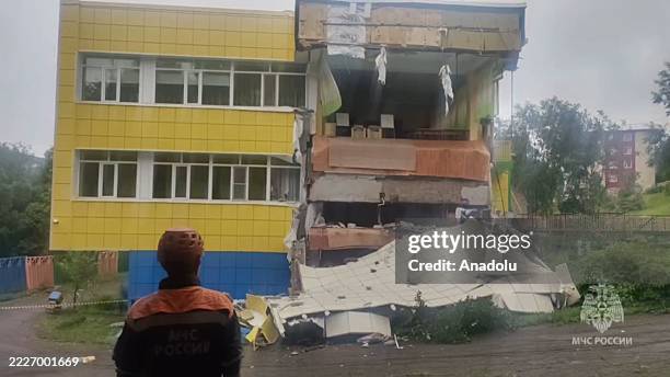 Screen grab from a video shows rescuers of the Ministry of Emergency Situations of Russia inspecting a damaged building after magnitude 8.8...