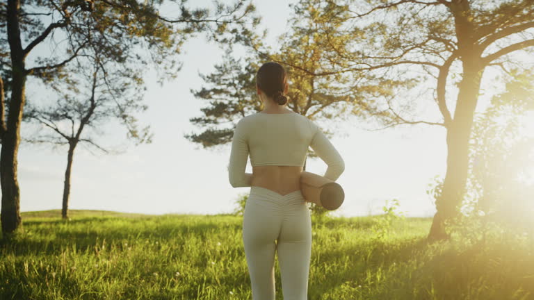 https://media.gettyimages.com/id/2227005740/video/young-woman-performs-yoga-outdoors.jpg?b=1&s=640x640&k=20&c=uRxVTTzCnzwKBafpky4-m8eFC4kFSz2VWSmKWjGOt9c=
