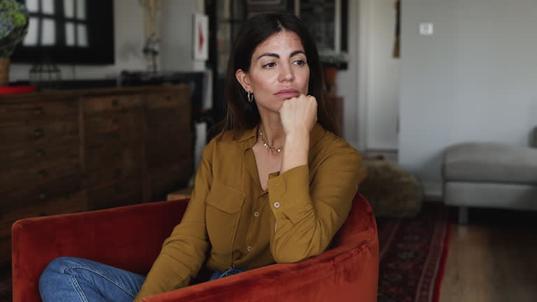 https://media.gettyimages.com/id/2227021191/video/woman-sitting-in-armchair-gazing-into-distance-with-melancholic-expression.jpg?b=1&s=640x640&k=20&c=-gm1dIhTkBM2jxE8wSRhQWTC5OtHSK5pOIJkAqDzocE=