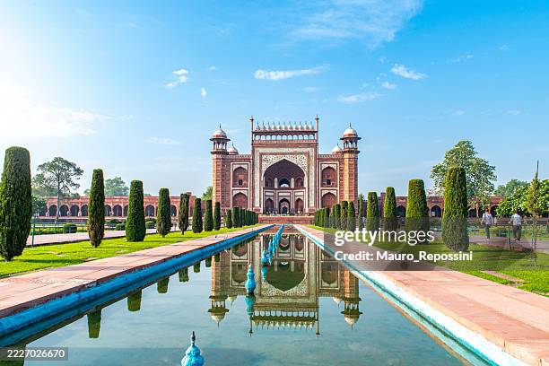 view of the main gateway located at the taj mahal complex at agra city, india - agra stock pictures, royalty-free photos & images