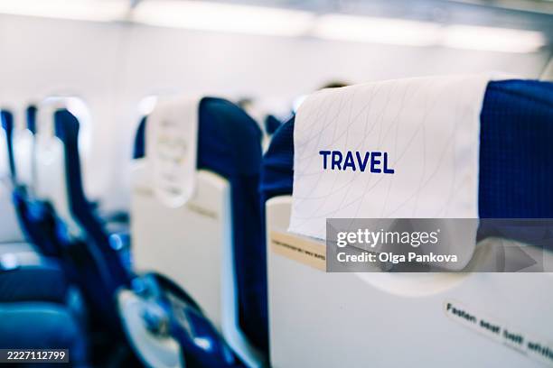 airplane seats awaiting passengers, ready for takeoff - economy class stock pictures, royalty-free photos & images
