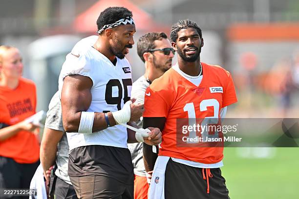 Defensive end Myles Garrett and quarterback Shedeur Sanders of the Cleveland Browns talk during training camp at CrossCountry Mortgage Campus on July...