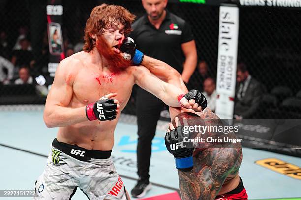 Marc-Andre Barriault of Canada punches Shara Magomedov of Russia in a middleweight fight during the UFC Fight Night event at Etihad Arena on July 26,...