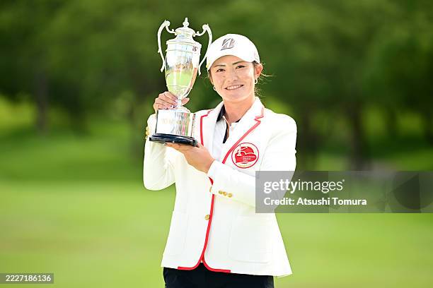 Ayaka Watanabe of Japan poses with the trophy after winning the tournament following the final round of DAITO KENTAKU eheyanet ladies at the Queen's...