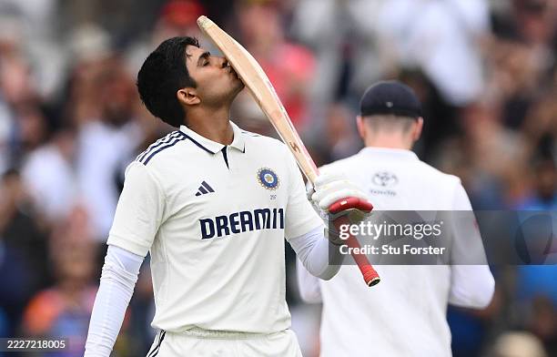 India batsman Shubman Gill kisses his bat after reaching his century during day five of the 4th Test Match between England and India at Emirates Old...