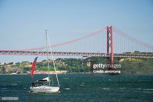 people cruising on tagus river - tagus river stock pictures, royalty-free photos & images
