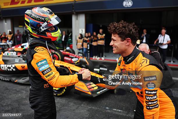 Race winner Oscar Piastri of Australia and McLaren and Second placed Lando Norris of Great Britain and McLaren congratulate each other in parc ferme...