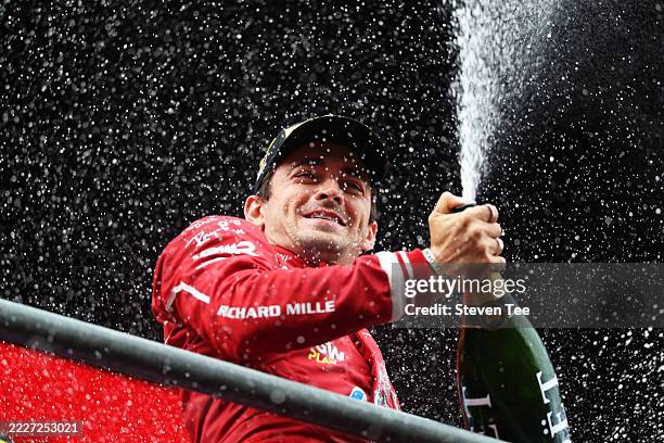 Third placed Charles Leclerc of Monaco and Scuderia Ferrari celebrates with champagne on the podium during the F1 Grand Prix of Belgium at Circuit de...