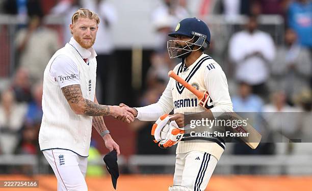 England captain Ben Stokes shakes hands with India batsman Ravindra Jadeja after day five of the 4th Test Match between England and India at Emirates...