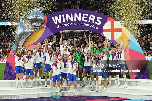 Leah Williamson and Keira Walsh of England lift the UEFA Women's EURO trophy after their team's victory in during the UEFA Women's EURO 2025 Final...