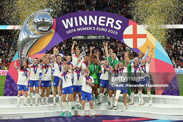 Leah Williamson and Keira Walsh of England lift the UEFA Women's EURO trophy after their team's victory in during the UEFA Women's EURO 2025 Final...