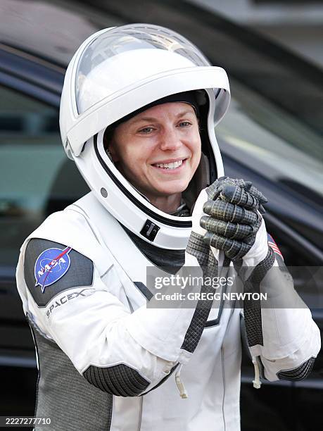 Crew-11 member NASA astronaut and mission commander Zena Cardman gestures to family and supporters as she departs the Neil A. Armstrong Operations...