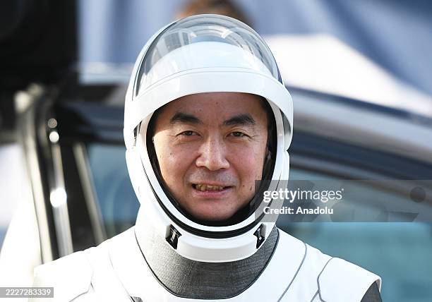 Astronaut Kimiya Yui greets family members outside the Neil A. Armstrong Operations and Checkout Building before heading to pad 39A for launch to the...