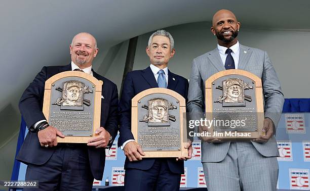 Inductees, from left, Billy Wagner, Ichiro Suzuki and CC Sabathia pose for a photograph with their plaques during the Baseball Hall of Fame induction...