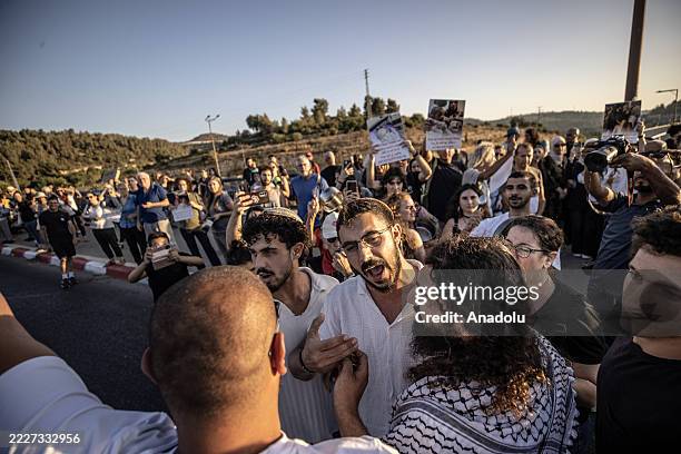 Protesters hold a demonstration at the entrance of the Abu Ghosh near East Jerusalem on August 1 in solidarity with Gaza amid ongoing Israeli attacks...