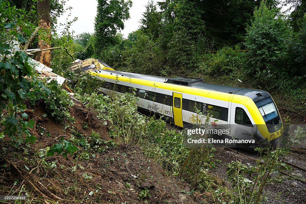 Wreckage lies at the site of a train derailment that has left three ...