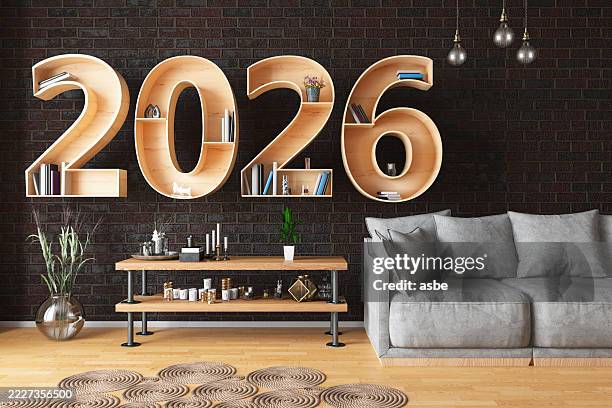 2026 bücherregal mit gemütlichem interieur - bücherregal stock-fotos und bilder