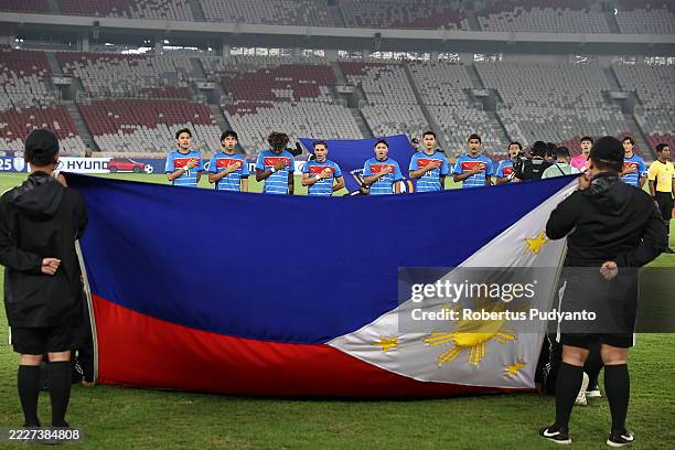 Philippines team sing national anthem during the Mandiri Cup 3rd place final between Philippines U23 and Thailand U23 at Gelora Bung Karno Stadium on...