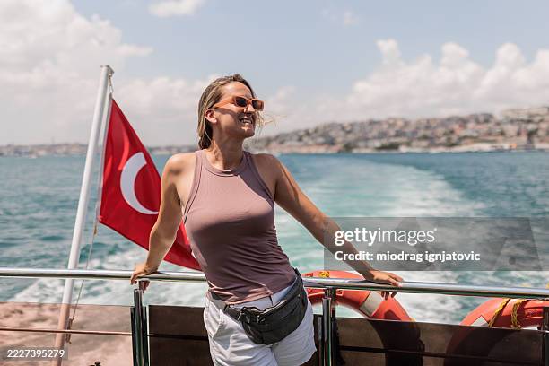 woman on a boat tour in the bosphorus - bosphorus stock pictures, royalty-free photos & images