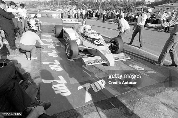 René Arnoux drives his Renault RE20B into the pit lane for inspection at the San Marino GP, Autodromo Dino Ferrari, Imola, Emilia-Romagna, Italy,...