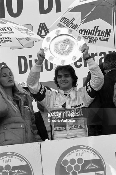 Nelson Piquet celebrates victory on the podium after the San Marino GP, Autodromo Dino Ferrari, Imola, Emilia-Romagna, Italy, Sunday 3rd May 1981.