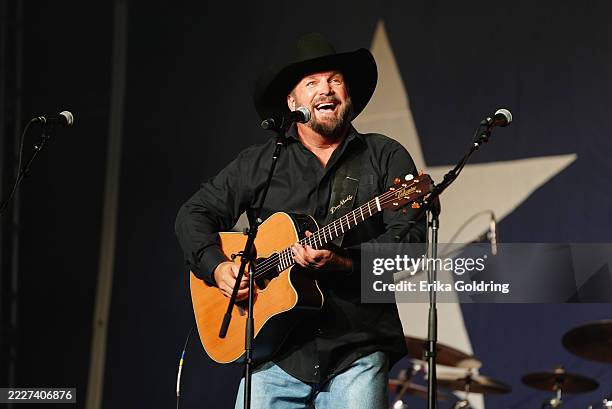 Garth Brooks performs onstage for George Strait and Vaqueros del Mar's "Strait To The Heart": A benefit for Hill Country Flood Victims at Estancia at...