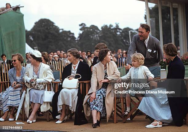 View of members of the British royal family on a reviewing stand on Smith's Lawn at Windsor Great Park, Windsor, England, June 23, 1957. Among those...